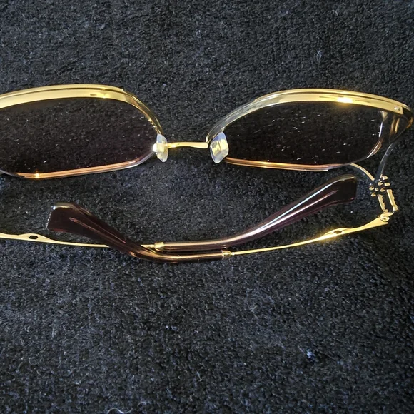 Miu Miu Gold and Pink Glasses with Chic Design